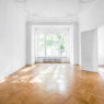 room in old apartment building with wooden parquet floor - real estate interior