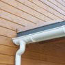 Closeup of problem areas for white rain gutter waterproofing.